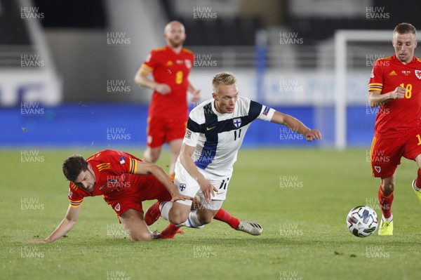 030920 - Finland v Wales - UEFA Nations League - Ben Davies of Wales tackles Ilmari Niskanen