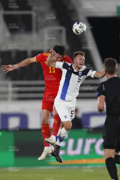 030920 - Finland v Wales - UEFA Nations League - Kieffer Moore of Wales and Leo Vaisanen of Finland compete