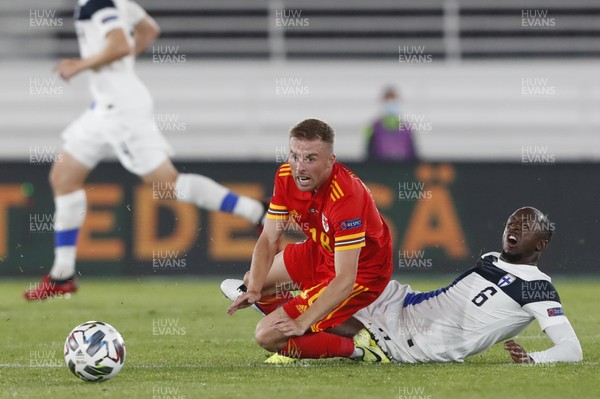 030920 - Finland v Wales - UEFA Nations League - Joe Morrell of Wales is tackled by Glen Kamara of Finland
