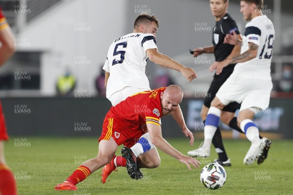 030920 - Finland v Wales - UEFA Nations League - Jonny Williams of Wales is tackled by Leo Vaisanen of Finland