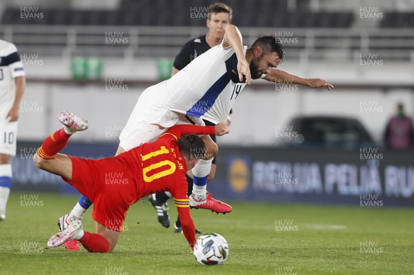 030920 - Finland v Wales - UEFA Nations League - Tim Sparv of Finland is tackled by Harry Wilson
