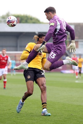 260425 - Fleetwood Town v Newport County - Sky Bet League 2 - Goalkeeper Jay Lynch of Fleetwood comes flying in to prevent Kyle Hudlin of Newport from scoring in the 10th minute