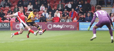 260425 - Fleetwood Town v Newport County - Sky Bet League 2 - Goalkeeper Jay Lynch of Fleetwood saves from a long shot by Bobby Kamwa of Newport