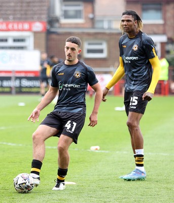 260425 - Fleetwood Town v Newport County - Sky Bet League 2 - David Ajiboye warms up alongside Kyle Hudlin of Newport