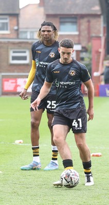 260425 - Fleetwood Town v Newport County - Sky Bet League 2 - David Ajiboye warms up alongside Kyle Hudlin of Newport