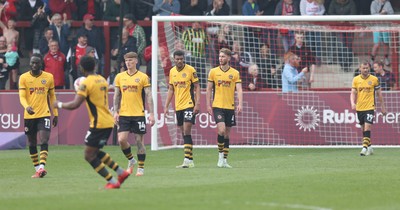 260425 - Fleetwood Town v Newport County - Sky Bet League 2 - Newport team walk back to the centre spot downhearted after the 2nd Fleetwood goal