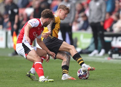 260425 - Fleetwood Town v Newport County - Sky Bet League 2 - Kai Whitmore of Newport and George Morrison of Fleetwood