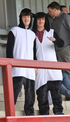 260425 - Fleetwood Town v Newport County - Sky Bet League 2 - Newport fans dressed as Penguins