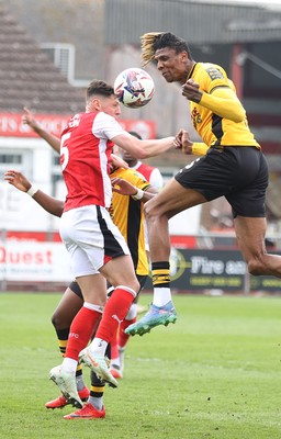 260425 - Fleetwood Town v Newport County - Sky Bet League 2 - Kyle Hudlin of Newport clears the high ball with James Bolton of Fleetwood
