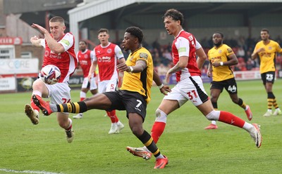260425 - Fleetwood Town v Newport County - Sky Bet League 2 - Bobby Kamwa of Newport is sandwiched between  Will Johnson of Fleetwood and Ryan Broom of Fleetwood