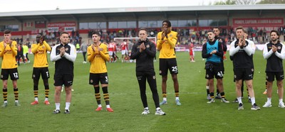 260425 - Fleetwood Town v Newport County - Sky Bet League 2 - Newport team led by Newport caretaker manager Dafydd Williams applaud the travelling fans at the end of the game