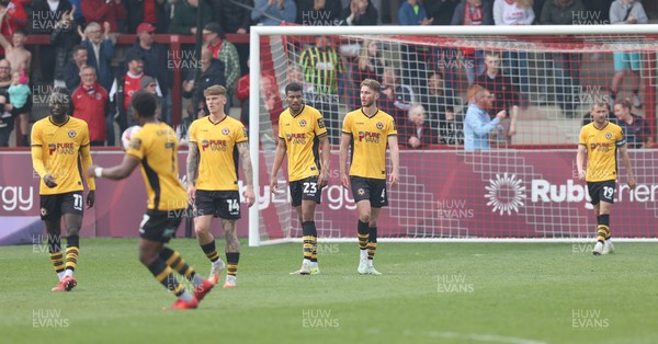 260425 - Fleetwood Town v Newport County - Sky Bet League 2 - Newport team walk back to the centre spot downhearted after the 2nd Fleetwood goal