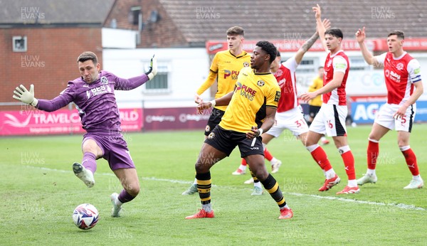 260425 - Fleetwood Town v Newport County - Sky Bet League 2 - Goalkeeper Jay Lynch of Fleetwood stops a shot on goal by Bobby Kamwa of Newport