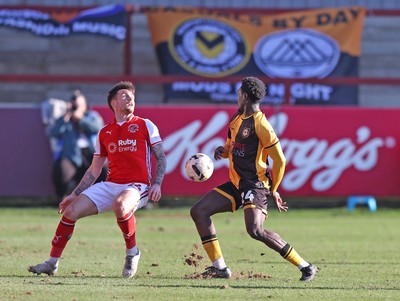280226 - Fleetwood Town v Newport County - Sky Bet League 2 - Nathan Opoku of Newport and Mitchell Clark of Fleetwood