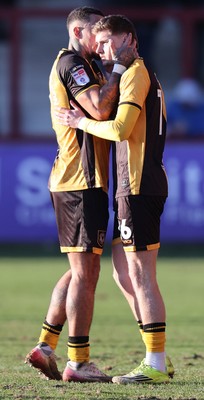 280226 - Fleetwood Town v Newport County - Sky Bet League 2 - Courtney Baker-Richardson of Newport welcomes on to pitch in 2nd half, James Crole of Newport sub