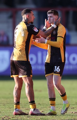280226 - Fleetwood Town v Newport County - Sky Bet League 2 - Courtney Baker-Richardson of Newport welcomes on to pitch in 2nd half, James Crole of Newport sub
