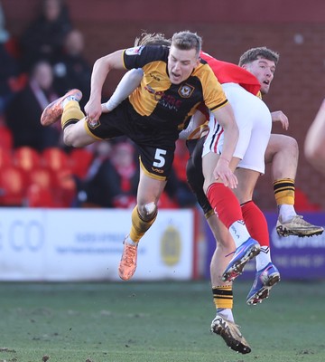 280226 - Fleetwood Town v Newport County - Sky Bet League 2 - Sven Sprangler of Newport and Will Davies of Fleetwood clash in the 2nd half
