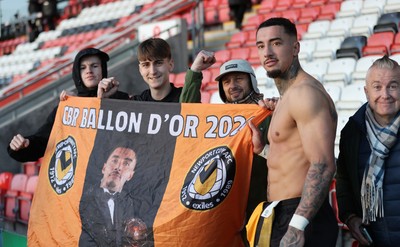 280226 - Fleetwood Town v Newport County - Sky Bet League 2 - Courtney Baker-Richardson of Newport with fans at the end of the match