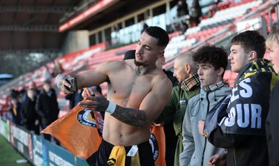 280226 - Fleetwood Town v Newport County - Sky Bet League 2 - Courtney Baker-Richardson of Newport with fans taking selfies