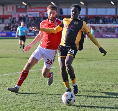 280226 - Fleetwood Town v Newport County - Sky Bet League 2 - Nathan Opoku of Newport and Shaun Rooney of Fleetwood