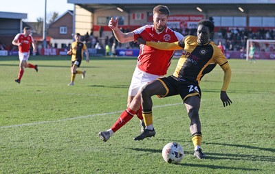 280226 - Fleetwood Town v Newport County - Sky Bet League 2 - Nathan Opoku of Newport and Shaun Rooney of Fleetwood