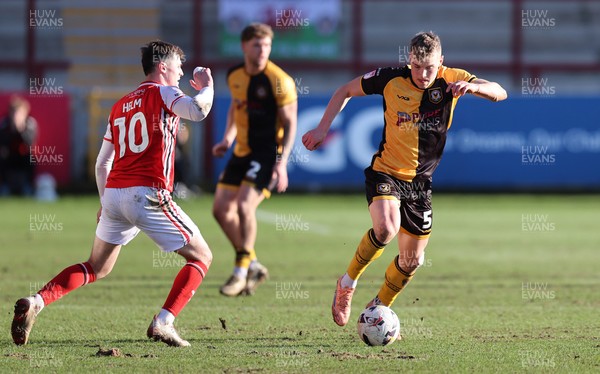 280226 - Fleetwood Town v Newport County - Sky Bet League 2 - Sven Sprangler of Newport makes his way up the field followed by Mark Helm of Fleetwood