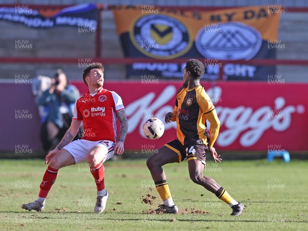 280226 - Fleetwood Town v Newport County - Sky Bet League 2 - Nathan Opoku of Newport and Mitchell Clark of Fleetwood