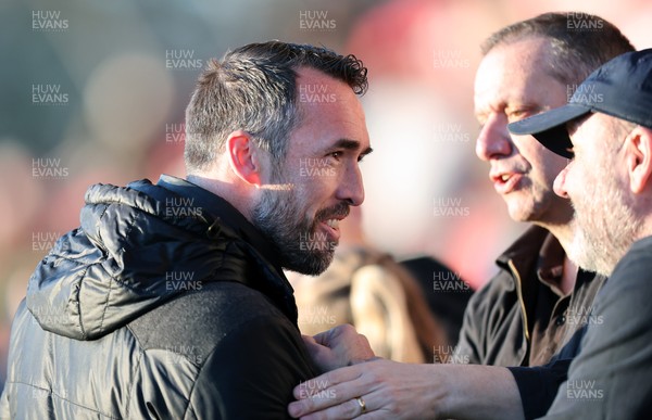 280226 - Fleetwood Town v Newport County - Sky Bet League 2 - Newport manager Christian Fuchs joins the travelling fans at the end of the match