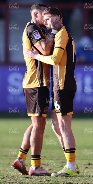 280226 - Fleetwood Town v Newport County - Sky Bet League 2 - Courtney Baker-Richardson of Newport welcomes on to pitch in 2nd half, James Crole of Newport sub