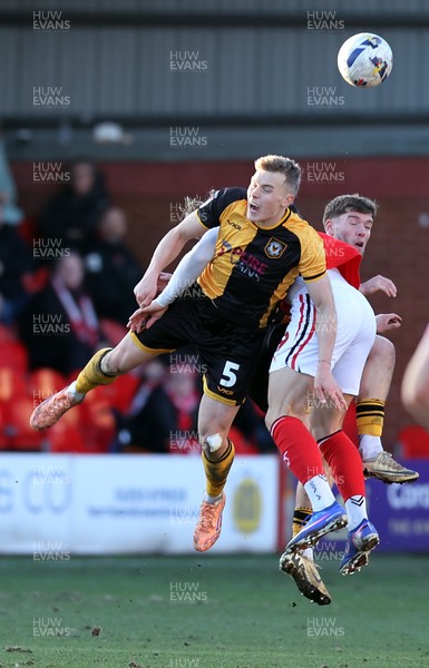 280226 - Fleetwood Town v Newport County - Sky Bet League 2 - Sven Sprangler of Newport and Will Davies of Fleetwood clash in the 2nd half