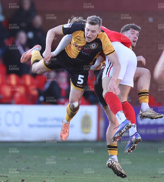280226 - Fleetwood Town v Newport County - Sky Bet League 2 - Sven Sprangler of Newport and Will Davies of Fleetwood clash in the 2nd half
