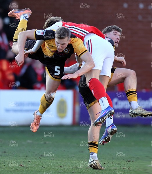 280226 - Fleetwood Town v Newport County - Sky Bet League 2 - Sven Sprangler of Newport and Will Davies of Fleetwood clash in the 2nd half