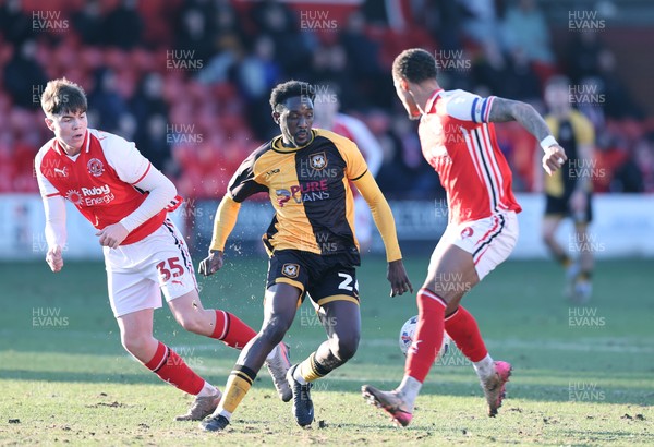 280226 - Fleetwood Town v Newport County - Sky Bet League 2 - Nathan Opoku of Newport tries to out do Elliot Bonds of Fleetwood and Conor Hughes of Fleetwood