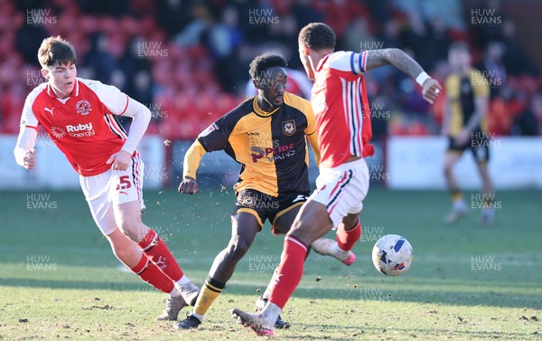 280226 - Fleetwood Town v Newport County - Sky Bet League 2 - Nathan Opoku of Newport tries to out do Elliot Bonds of Fleetwood and Conor Hughes of Fleetwood