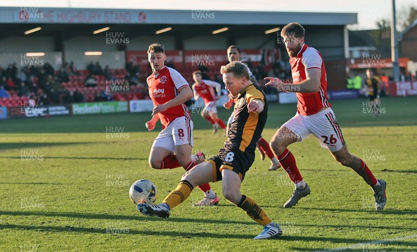280226 - Fleetwood Town v Newport County - Sky Bet League 2 - Matthew Smith of Newport in goalmouth followed by Shaun Rooney of Fleetwood and Matty Virtue of Fleetwood