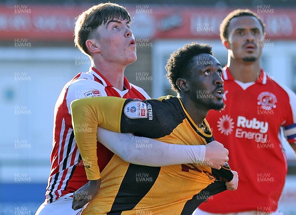 280226 - Fleetwood Town v Newport County - Sky Bet League 2 - Nathan Opoku of Newport is held by Conor Houghey of Fleetwood