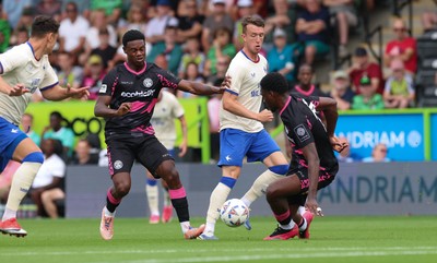 250726 - Forest Green Rovers v Cardiff City, Pre-Season Friendly - David Turnbull of Cardiff City takes on Emeka Obi of Forest Green Rovers