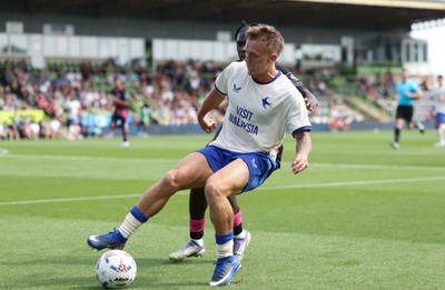 250726 - Forest Green Rovers v Cardiff City, Pre-Season Friendly - Isaak Davies of Cardiff City holds off Sydney Agina of Forest Green Rovers