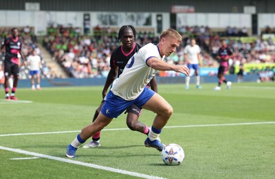 250726 - Forest Green Rovers v Cardiff City, Pre-Season Friendly - Isaak Davies of Cardiff City holds off Sydney Agina of Forest Green Rovers