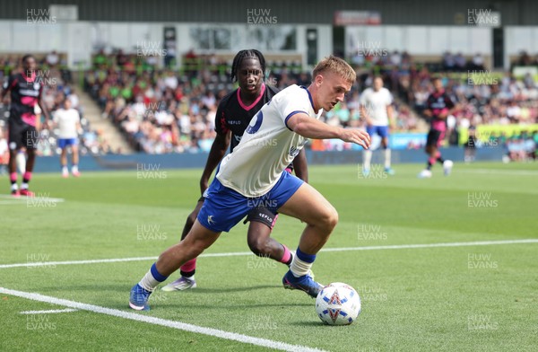 250726 - Forest Green Rovers v Cardiff City, Pre-Season Friendly - Isaak Davies of Cardiff City holds off Sydney Agina of Forest Green Rovers