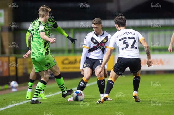 011220 - Forest Green Rovers v Newport County - Sky Bet League 2 - Carl Winchester of Forest Green is tackled by Scot Bennett of Newport County