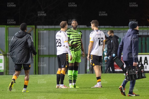 011220 - Forest Green Rovers v Newport County - Sky Bet League 2 - Jamille Matt of Forest Green catches up with Mickey Demetriou of Newport County and Jamie Proctor of Newport County