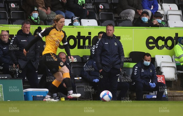 230521 - Forest Green Rovers v Newport County - SkyBet League Two Play off Semi-Final, Second Leg - Newport County manager Michael Flynn and the backroom staff look on as Newport concede two early goals