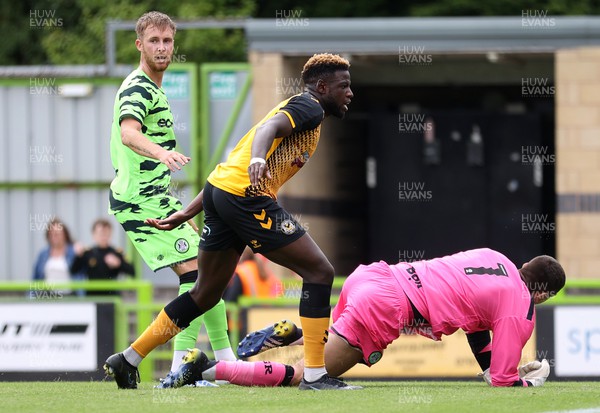 230722 - Forest Green Rovers v Newport County - Pre Season Friendly - Offrande Zanzala of Newport County gets the ball past keeper Luke McGee of Forest Green Rovers to score a goal