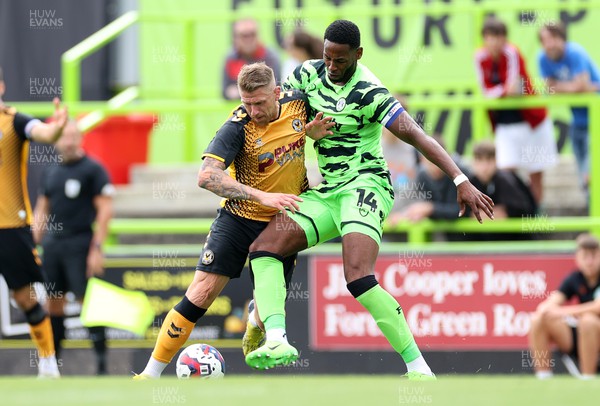 230722 - Forest Green Rovers v Newport County - Pre Season Friendly - Scot Bennett of Newport County is challenged by Jamille Matt of Forest Green Rovers