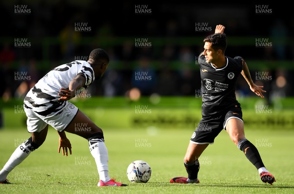 280721 - Forest Green Rovers v Swansea City - Preseason Friendly - Yan Dhanda of Swansea City is tackled by Sadou Diallo