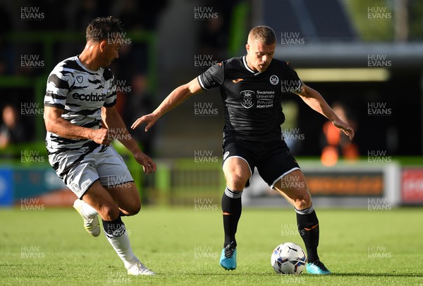 280721 - Forest Green Rovers v Swansea City - Preseason Friendly - Jake Bidwell of Swansea City is tackled by Kane Wilson