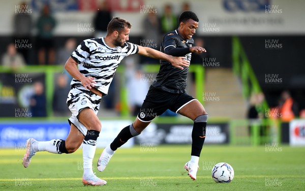280721 - Forest Green Rovers v Swansea City - Preseason Friendly - Morgan Whittaker of Swansea City is tackled by Baily Cargill