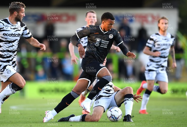 280721 - Forest Green Rovers v Swansea City - Preseason Friendly - Morgan Whittaker of Swansea City is tackled by Baily Cargill and Jack Evans