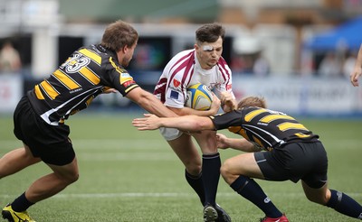 280816 - National Foster's 7s - Swansea's Jac Wilson is tackled by Geraint O'Driscoll and Arwel Robson during the match against Newport